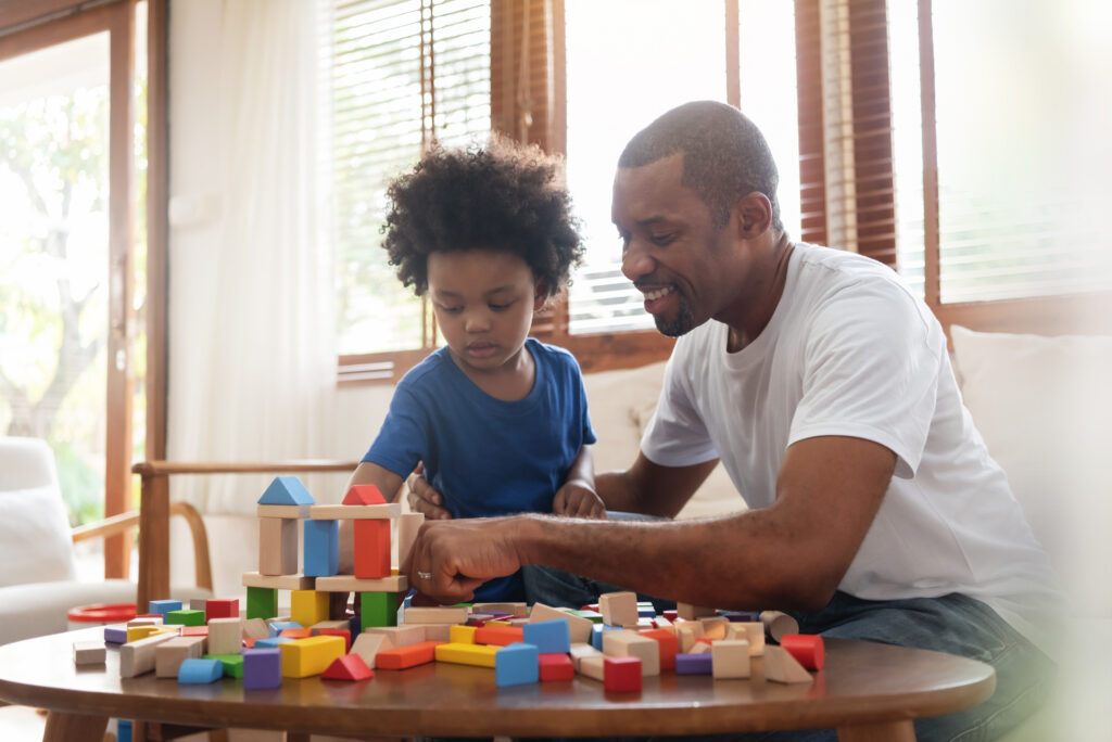 Teacher and child playing.