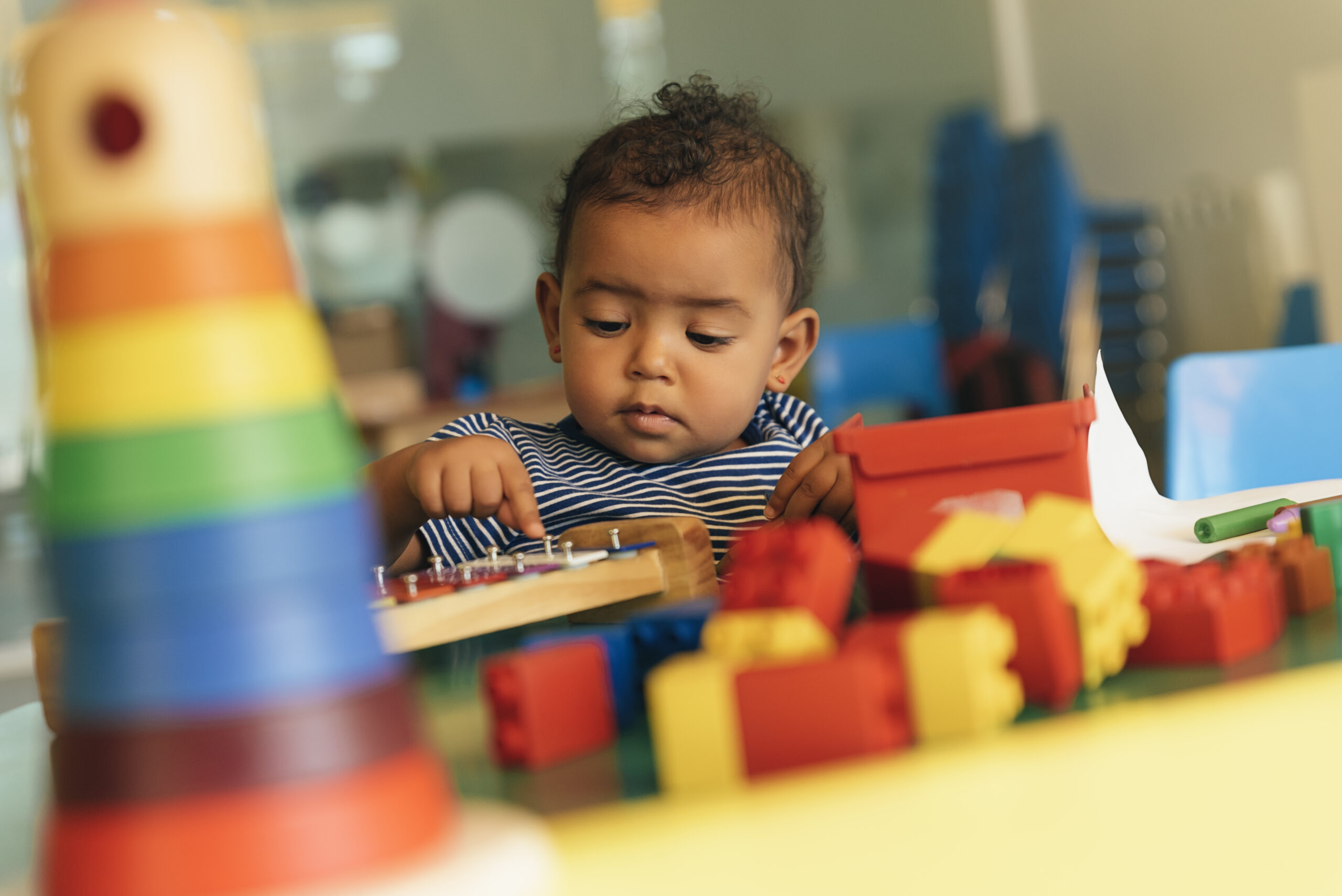 Young child playing with blocks.