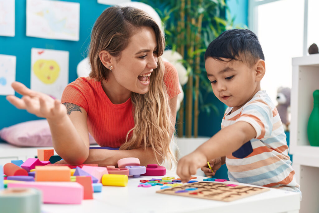 Teacher and child playing.