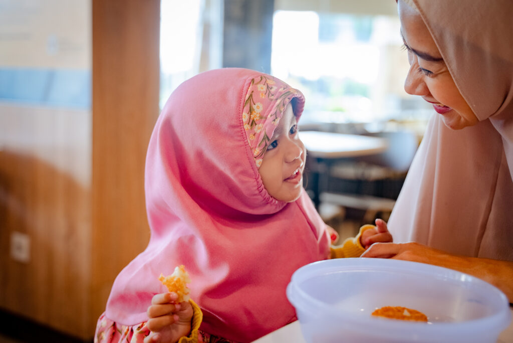 Mother and Daughter eating.