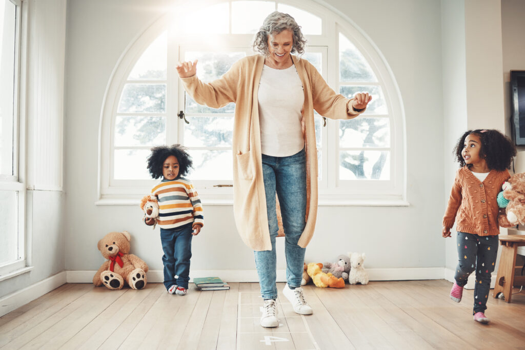 Teacher and two children play.